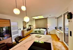 a living room with a couch and a table at Ferienwohnung Harzurlaub II in Hahnenklee-Bockswiese