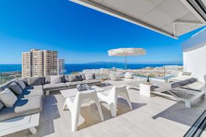 a living room with a view of the ocean at White Haven in Adeje