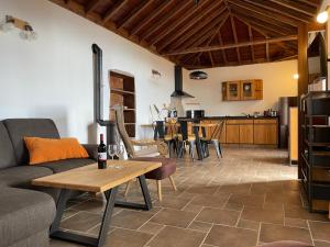 a living room with a couch and a table at Casa Gecko in Tijarafe