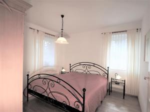 Postel nebo postele na pokoji v ubytování Birkmaase 12 - Kapitänshaus Jacqueline 4-Sterne Komfort FeWo im EG links