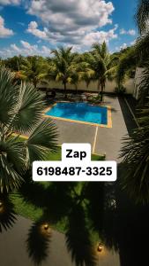 Bazén v ubytování A Casa Paradisiaca l Luxo Piscina Super Hiper Quente 60 Graus Aquecimento Elétrico e Piscina Enorme com Roupa de Cama e Banho Aceitamos PET nebo v jeho okolí