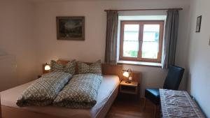 Ένα ή περισσότερα κρεβάτια σε δωμάτιο στο Haus Polleichtner