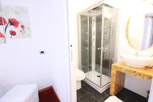 a bathroom with a shower and a sink at Black and White in Cantù +2 photos