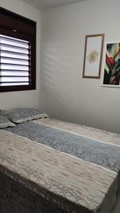 Ένα ή περισσότερα κρεβάτια σε δωμάτιο στο Quartos em Casa Familiar, Aeroclube, Praia do Bessa +2 φωτογραφίες