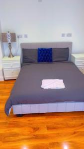 Postel nebo postele na pokoji v ubytování Maxismile Rooms