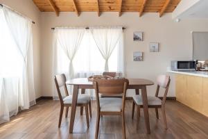 a kitchen and dining room with a table and chairs at NEW Casa Marea Beach Front House DT 2BR WiFi & AC in Colonia Cuauhtemoc