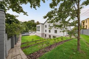 a view of a house with a yard at Studija-butas Markučiuose in Vilnius
