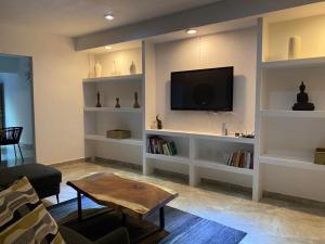 TV a/nebo společenská místnost v ubytování Casa ziranda