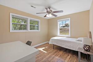 a bedroom with two beds and a ceiling fan at Entertaining 5 Bedrooms Luxury DC Vibe in Springfield