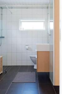 a bathroom with a sink and a toilet at OGO730-Vikbolandet-Vaerldens-Aende-46 in Arkösund