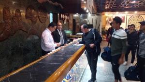 a group of people standing around a bar at Arafa Hotel - فندق عرفه الجديد in Tanta +20 photos