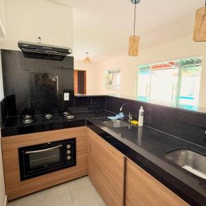 Kuchyň nebo kuchyňský kout v ubytování Casa 123 Milagres - Casa em São Miguel dos Milagres, Alagoas