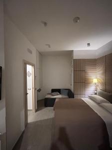 a hotel room with a bed and a window at International Naples in Naples