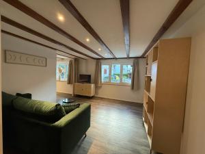 a living room with a couch and a tv at smartroom Apartment in Wettingen in Wettingen