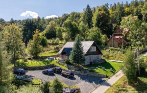 an aerial view of a house with cars parked in a driveway at Saneczkowa 1 in Piechowice