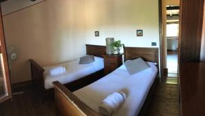 Ένα ή περισσότερα κρεβάτια σε δωμάτιο στο Casa Sharon