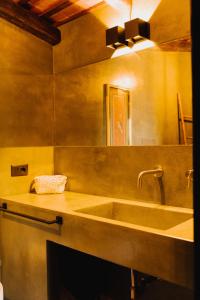 a bathroom with a sink and a mirror at QUIETE e MARE in San Vito lo Capo