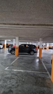 a black car parked in a parking garage at Aquí me quedo Catedral in Burgos