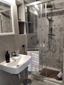 a bathroom with a sink and a shower at Home 56 vacation home in Salerno
