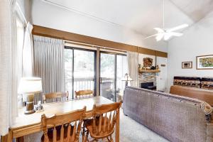 a dining room with a table and a large window at Hidden Valley 26 D in Mammoth Lakes