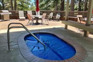 a small swimming pool with a bench and a table at Hidden Valley 26 D in Mammoth Lakes