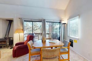 a living room with a table and a couch at Hidden Valley 30 D in Mammoth Lakes