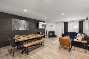 a living room with a dining table and a couch at The Drift in Brian Head