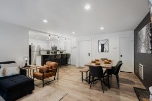 a living room and dining room with a table and chairs at The Drift in Brian Head