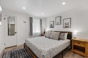 a bedroom with a large bed and a mirror at The Drift in Brian Head
