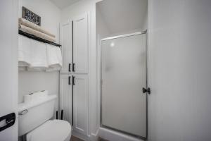 a white bathroom with a shower and a toilet at The Drift in Brian Head +39 photos