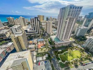 an aerial view of a city with tall buildings at Two Amazing Views in One Spacious Condo Getaway in Honolulu