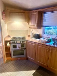 Kuchyň nebo kuchyňský kout v ubytování East Coast