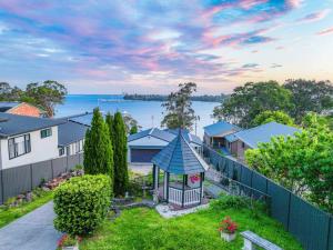 an aerial view of a house with a gazebo at Bayview Bliss Brightwaters in Morisset East
