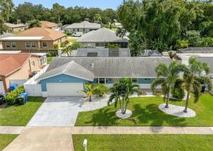 an aerial view of a house with palm trees at Villa W pool in Clearwater in Clearwater