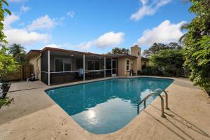 a swimming pool in front of a house at Water front in Clearwater in Clearwater
