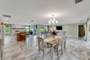 a dining room and living room with a table and chairs at Water front in Clearwater in Clearwater