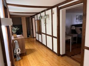 a hallway with a door open to a living room at Dammablick Göschenen in Göschenen