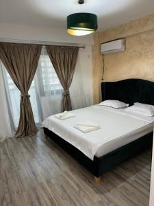 Ένα ή περισσότερα κρεβάτια σε δωμάτιο στο Apartament Daniela