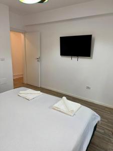 Ένα ή περισσότερα κρεβάτια σε δωμάτιο στο Apartament Daniela