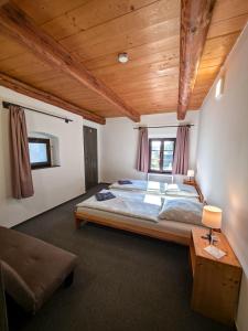 Postel nebo postele na pokoji v ubytování Pivovar Mlýn