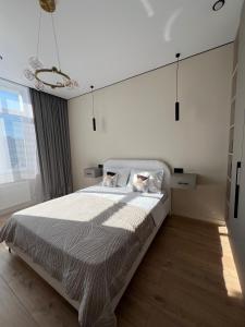 Postel nebo postele na pokoji v ubytování Luxury Apartment in Buqar Jyrau