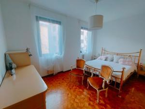 Ένα ή περισσότερα κρεβάτια σε δωμάτιο στο Apartment in the historic center - Tirano - Casa Vacanze da Amy