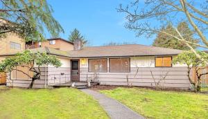 a large white house with a sidewalk in front of it at Spacious Retreat 3 Miles to Airport 12 to Seattle in Burien