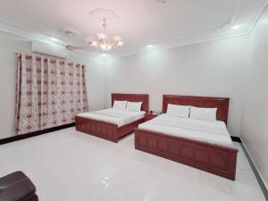 Una cama o camas en una habitación de Family Rose Guest House Millennium 24 fotos más