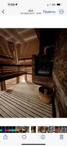 a picture of a room with a fireplace at Банний Двір in Kryvyi Rih