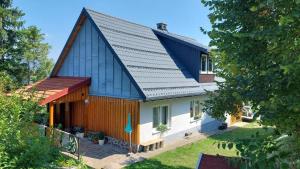 a large house with a gambrel roof at House Zeleni brig in Mrkopalj