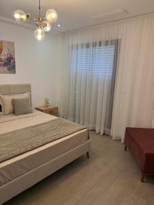 Postel nebo postele na pokoji v ubytování Jardin de Carthage