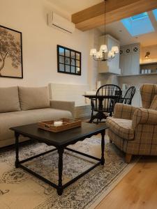 a living room with a couch and a table at Apartamenty Guzik 32 in Krosno