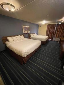 Postel nebo postele na pokoji v ubytování Rusina Inn + 3 fotografie