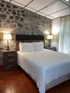 Ένα ή περισσότερα κρεβάτια σε δωμάτιο στο Gran Bonanza Hotel